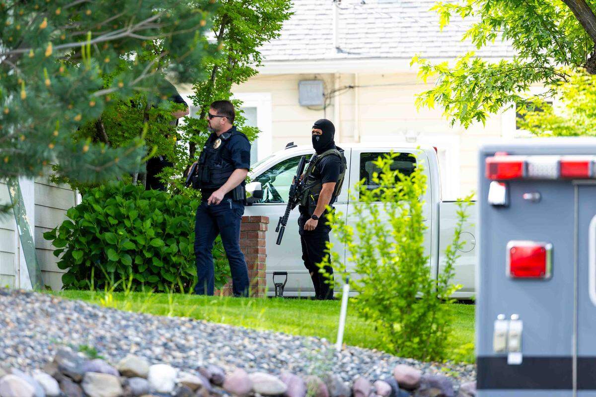 Tri-City Metro Drug Task Force officers search a home in the 1700 block of Gaillard Place in Richland on Wednesday.