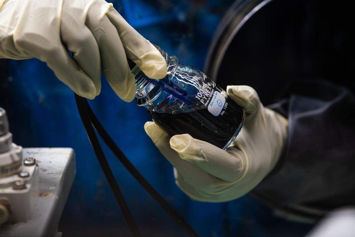 Researchers prepare an experimental flow battery electrolyte. In a 2023 study, scientists at PNNL used a dissolved simple sugar called β-cyclodextrin, a derivative of starch, to boost flow battery longevity and capacity.