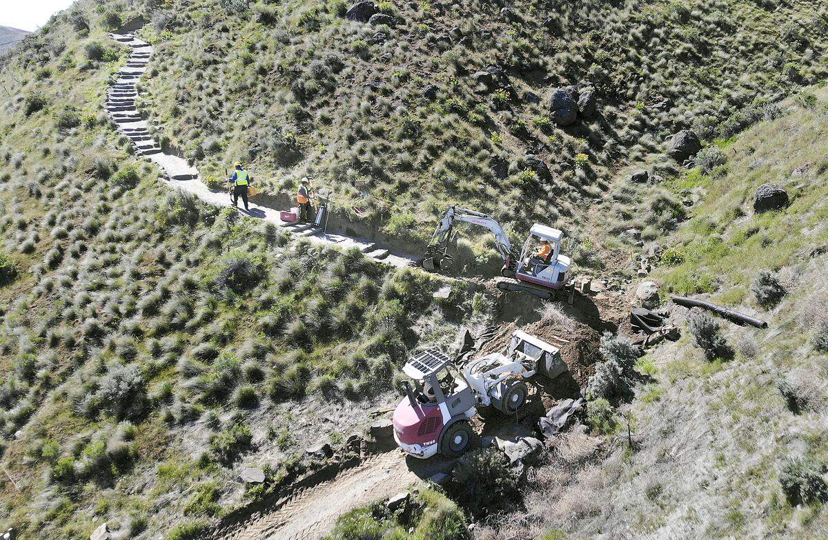 Workers from Allstar Construction Group start replacing stairs on the Badger Mountain Canyon Trail on Monday at the popular hiking spot near Trailhead Park in south Richland. The city closed the trail on April 25 for 3 to 4 weeks but people can still hike the 1,579-foot mountain using the Bypass Trail. Watch a video at: tricityherald.com/video