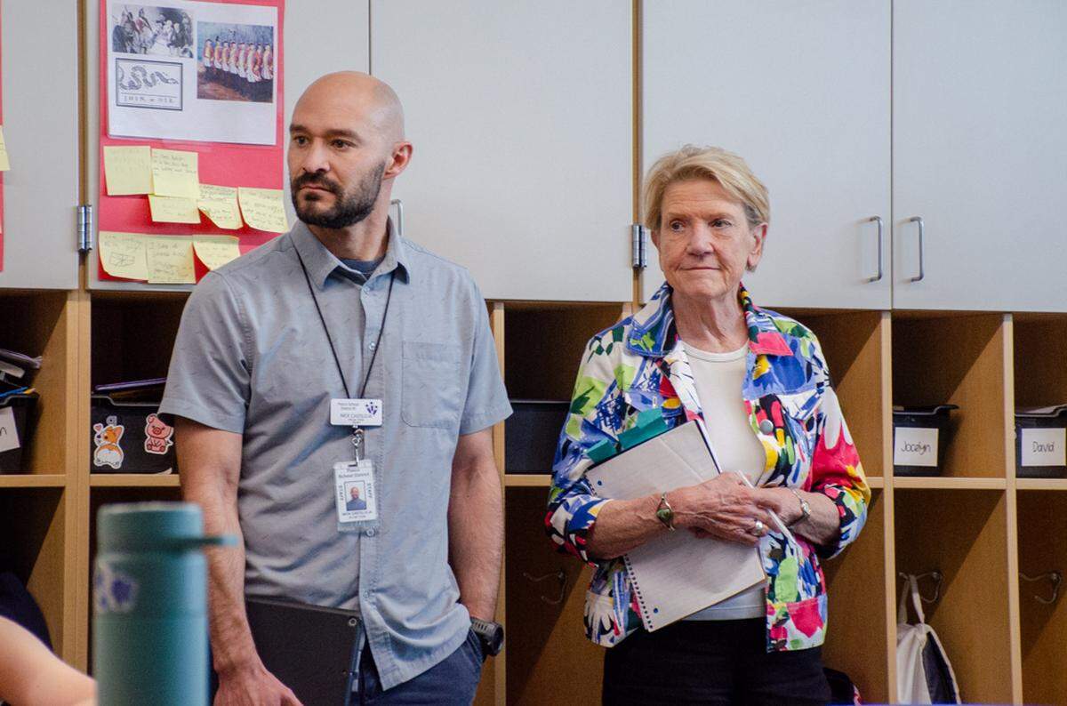 Nick Castilleja, a support personnel with Pasco School District, and Highly Capable program supervisor Jody Hess, of Washington OSPI, listen in on 5th grade writing assignments at Three Rivers Elementary School in Pasco.