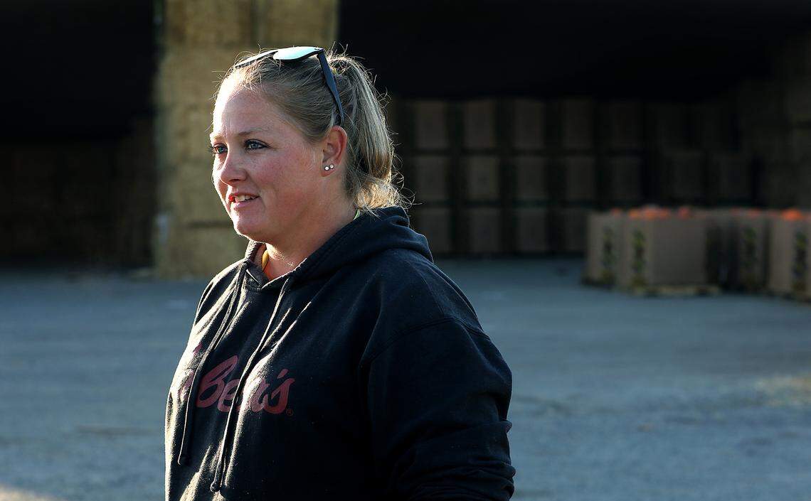 Ashley Cox smiles while talking about growing up and raising pumpkins at her father’s farm in Badger Canyon near Benton City.