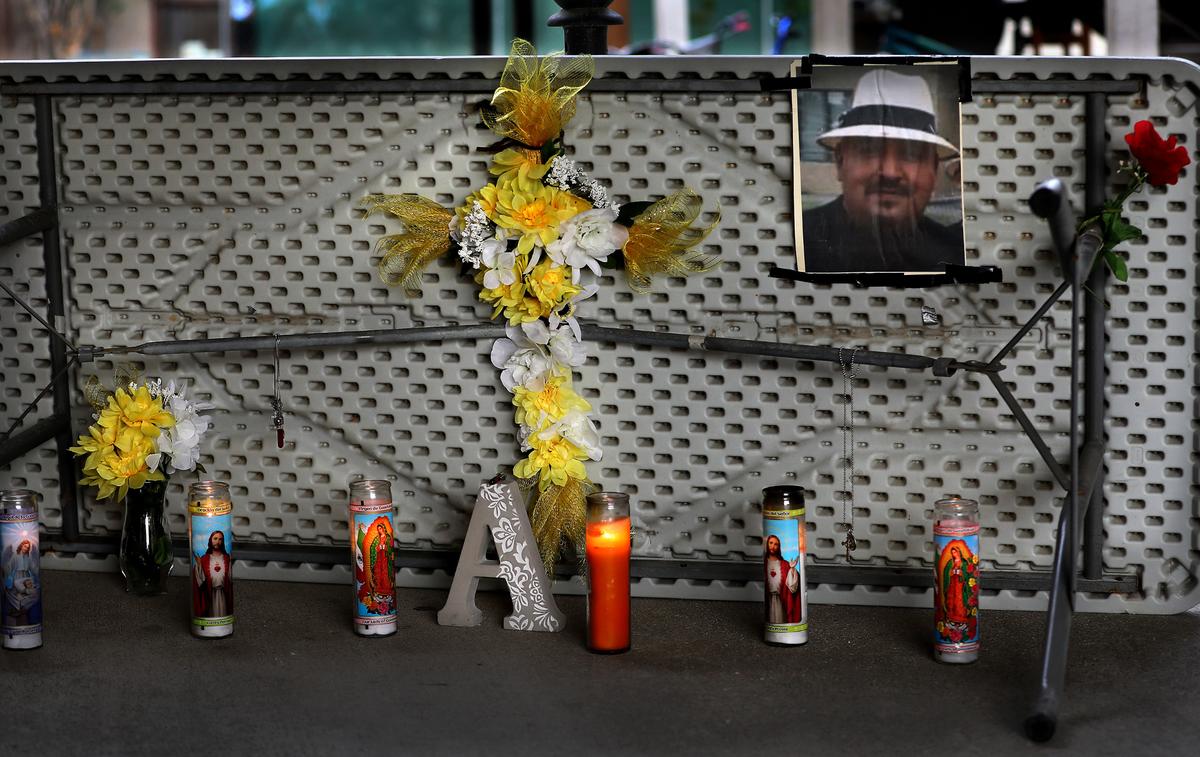 A memorial created by family and friends sits in the breezeway of the Kennewick apartment building on North Tweedt Street where Arthur Amaya was shot to death.
