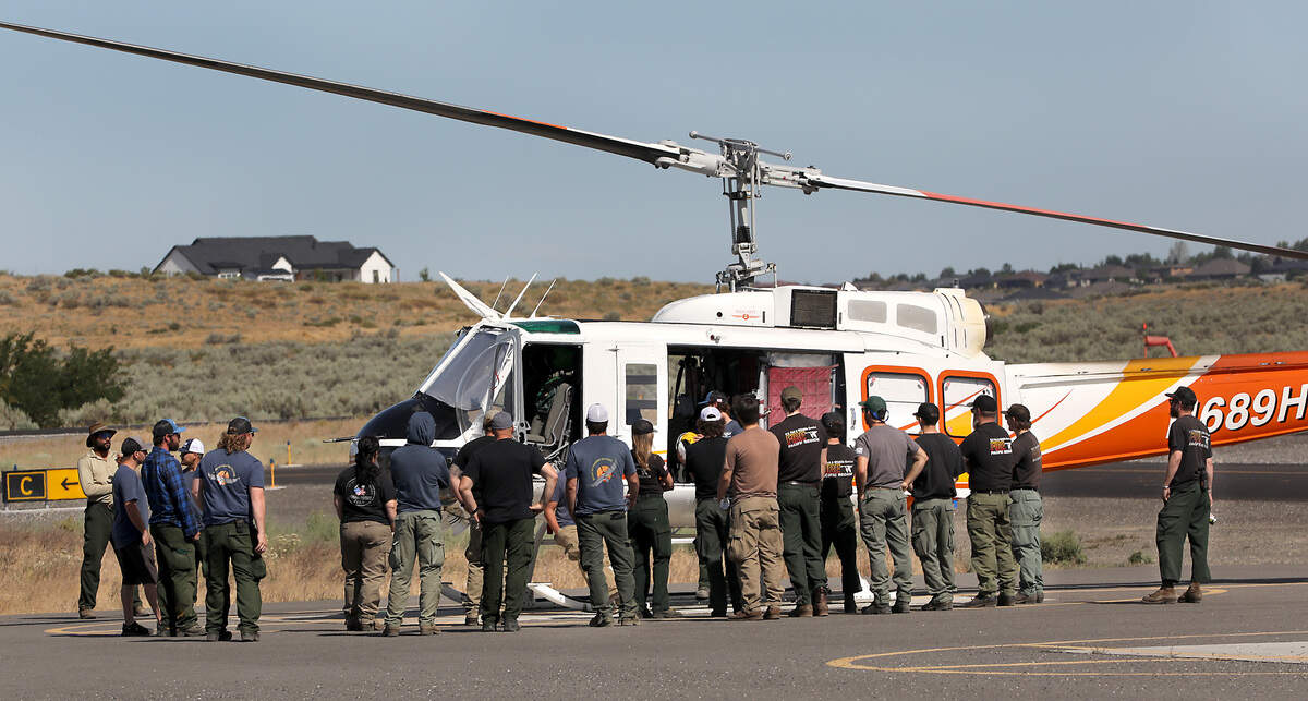 Fire crews get a close up training sesson Tuesday morning of a helicopter stationed at the Port of Benton's Richland Airport.