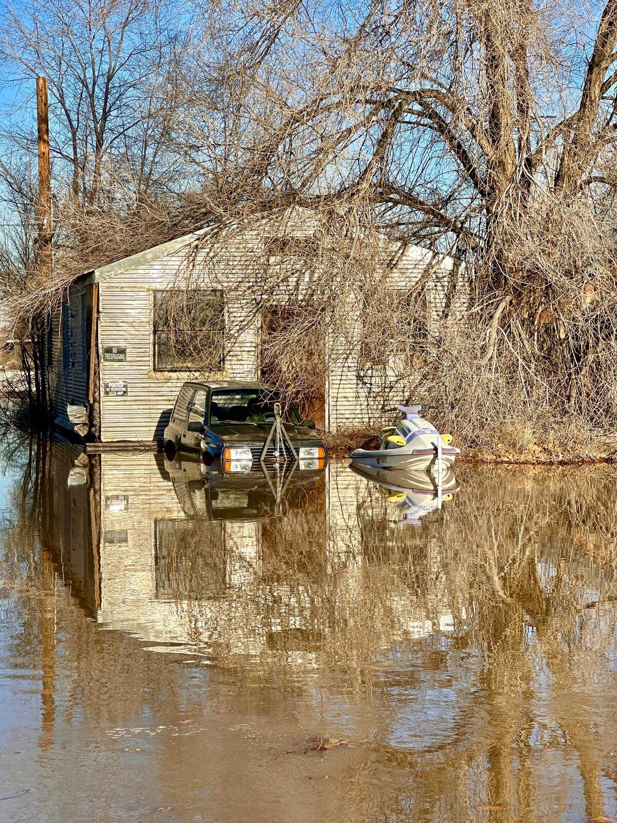 Yakima River flood surge washes up to home along Van Giesen Street in West Richland on Saturday, Dec. 13.