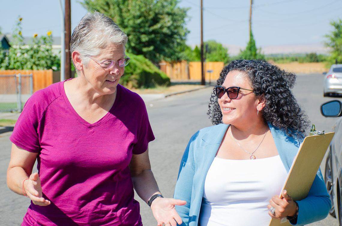 Ana Ruiz Kennedy, right, a Pasco Democrat running for Washington’s recently redrawn 14th Legislative District, doorbells Sept. 3 in a Toppenish neighborhood with Washington House Speaker Laurie Jinkins, D-Tacoma.