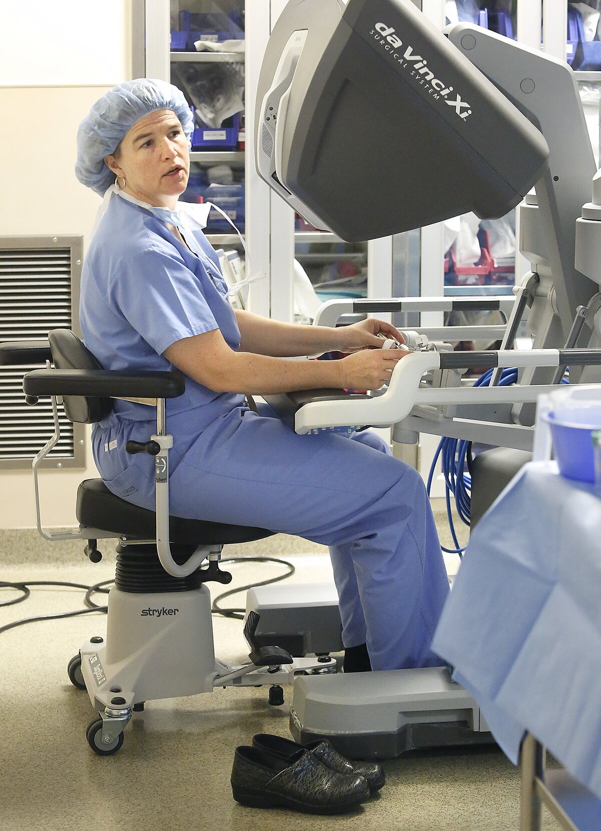 Dr. Wanda Good looks out from the console of the newest version of the da Vinci Xi Surgical System while recently performing a robotic-assisted bariatric surgical procedure at Lourdes Health in Pasco. The system's 3D-HD vision system provides surgeons a highly magnified view for them to perform minimally-invasive surgical procedures. Good celebrated her 500th robotically-assisted surgery in April. Watch a video at: tri-cityherald.com/video
