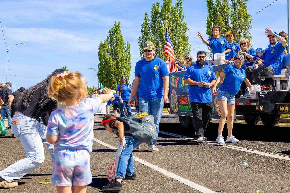 Children scramble for candy tossed from a parade float by members of Local 112 of the International Brotherhood of Electrical Workers during Pasco’s Cinco de Mayo parade on Saturday in downtown Pasco.