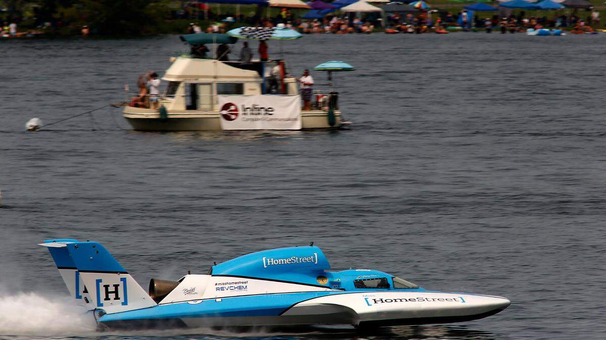Jimmy Shane in the U-1 Miss Homestreet Bank takes the checker flag during heat 5 of the Columbia Cup unlimited hydroplane race on the Columbia River in Kennewick in 2022.