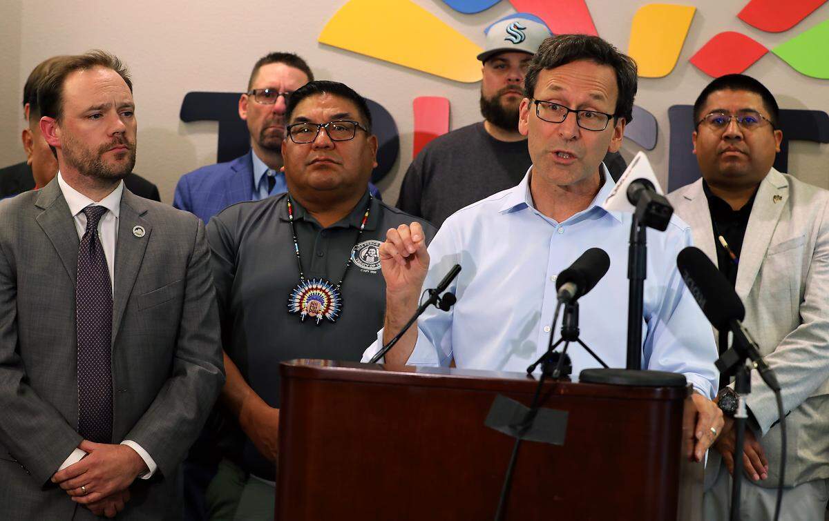 Wash. Gov. Bob Ferguson speaks at a news conference Friday about the Department of Energy’s possible plan to delay or cancel startup of the Hanford Waste Treatment Plant next month. State, tribal and community leaders stand behind him at the TRIDEC office in Kennewick.