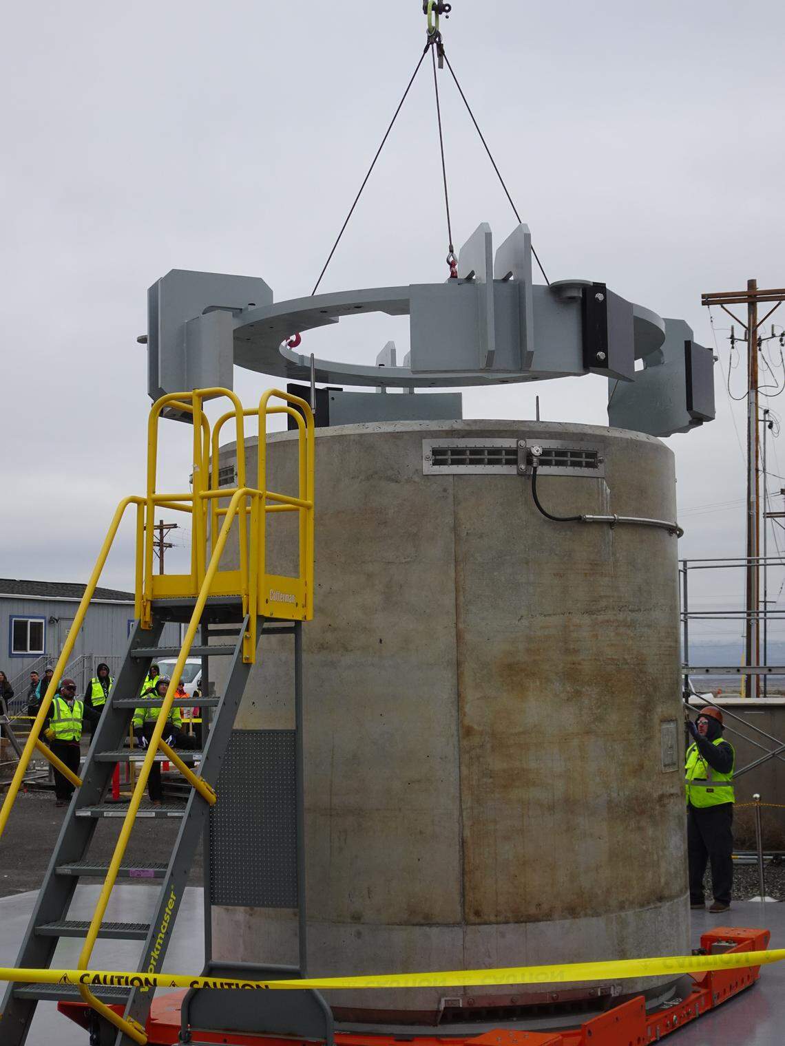A concrete cask filled with cesium capsules for outdoor, dry storage at the Hanford nuclear site is prepared for transport.