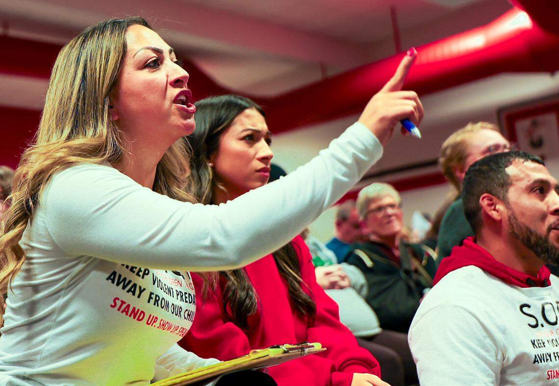 Janette Romero, neighborhood organizer, speaks out against a proposed sex offender house during a January town hall meeting at Highlands Middle School. The crowd was estimated at 300.