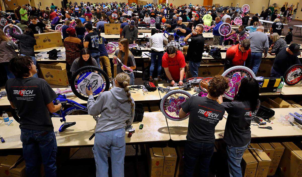 Students from Tri-Tech Skills Center are part of about 600 volunteers at the 14th annual Bikes for Tikes bike build event at the Three Rivers Convention Center in Kennewick. The volunteers assembled 1,600 bicycles in about four hours for distribution by various organizations to children in need throughout the Mid-Columbia. The Bikes for Tikes organization was founded in 2009 by the Plumbers & Steamfitters UA Local 598 and through this year have donated 20,000 bicycles..