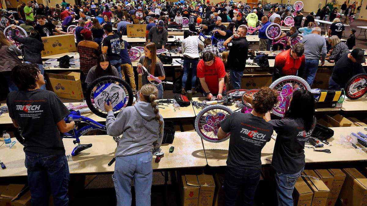 Students from Tri-Tech Skills Center are part of about 600 volunteers at the 14th annual Bikes for Tikes bike build event at the Three Rivers Convention Center in Kennewick. The volunteers assembled 1,600 bicycles in about four hours for distribution by various organizations to children in need throughout the Mid-Columbia. The Bikes for Tikes organization was founded in 2009 by the Plumbers & Steamfitters UA Local 598 and through this year have donated 20,000 bicycles..