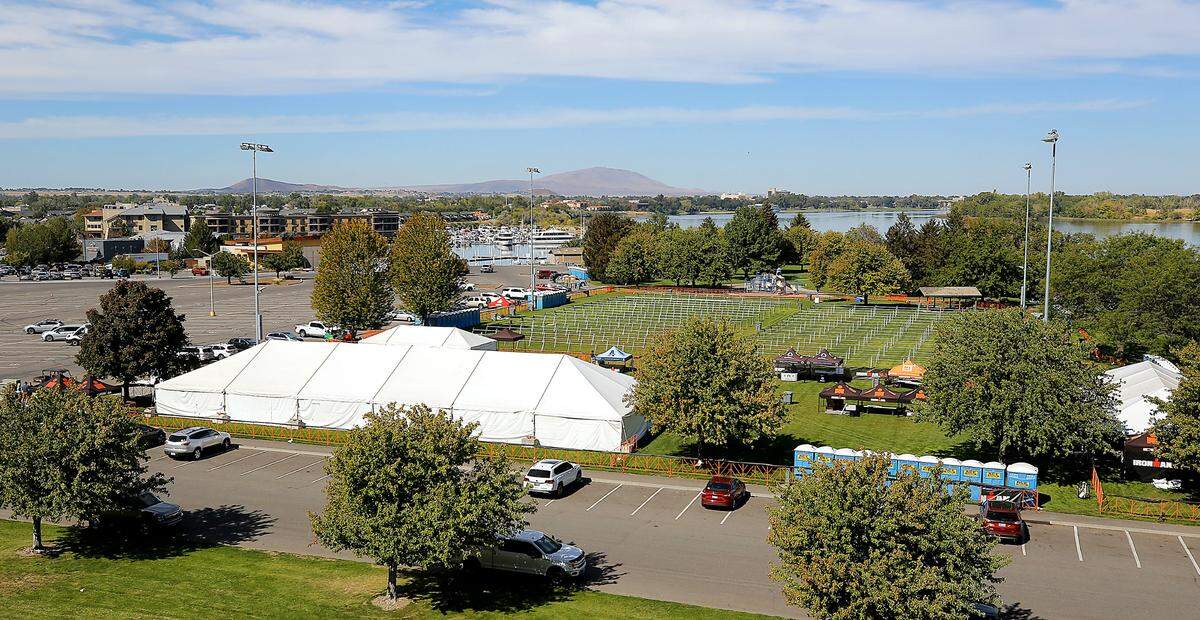 Ironman athlete village sprawls across the field at the Columbia Point Marina Park in Richland.