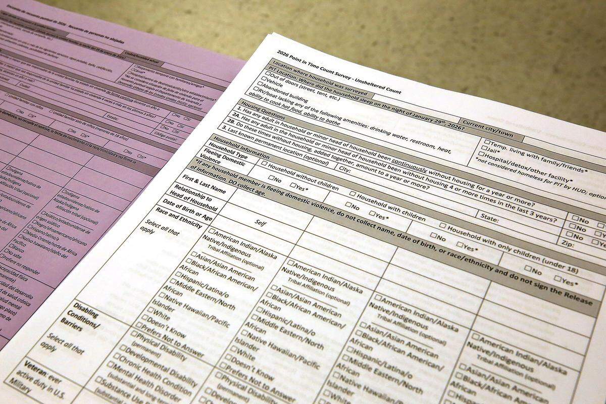 Stacks of field survey forms sit on a table in a meeting room at the Benton Franklin Health District building in Kennewick. They were handed out to volunteers participating in the annual Point in Time homeless count.