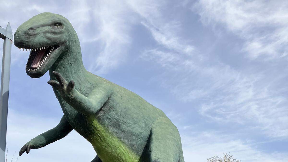 Lee Walter and his grandson visit the dinosaur park in Granger, Wash.