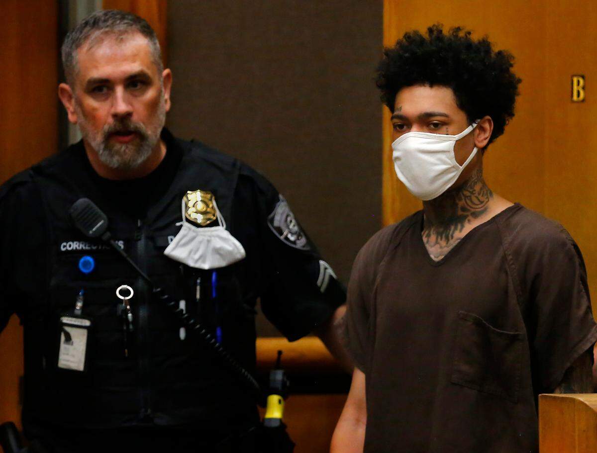 Murder suspect Lawrence Isaiah Groce is brought into a courtroom by a corrections officer Wednesday at the Benton County Justice Center in Kennewick. He is charged in the 2018 shooting death of Hunter Black.