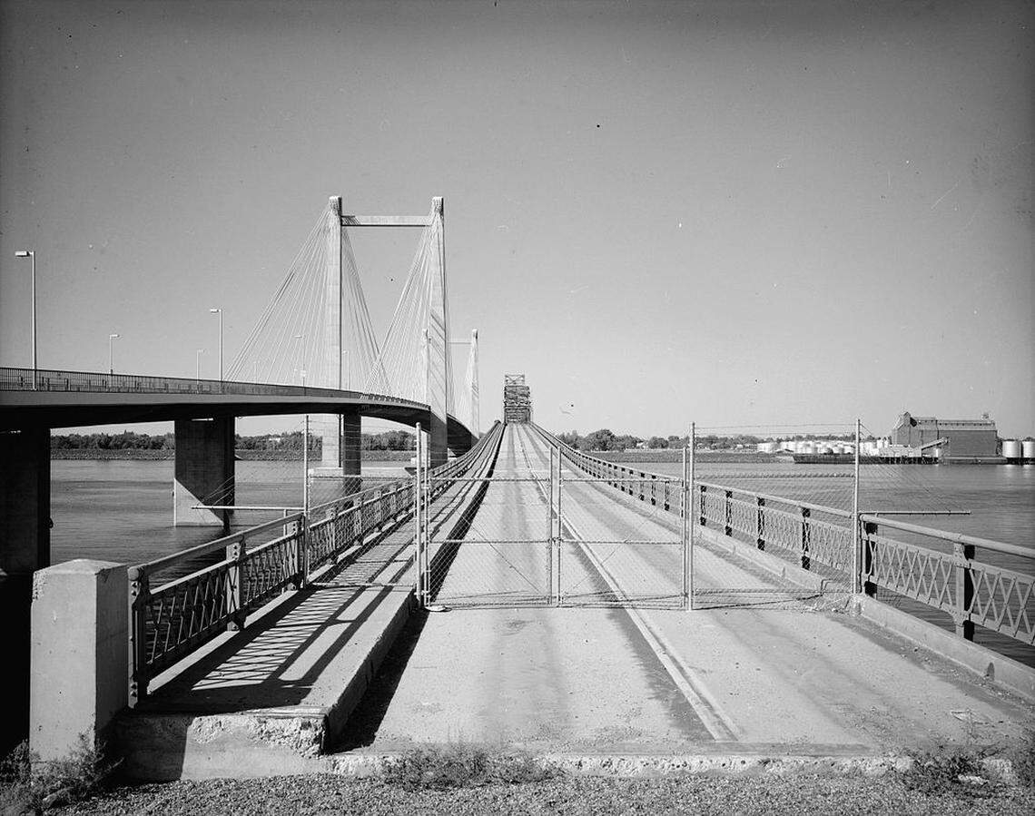 The 1922-built green bridge is overshadowed by its replacement, the Ed Hendler cable bridge, which opened in 1978. The old bridge was demolished in 1990 after a fierce battle to preserve it failed.