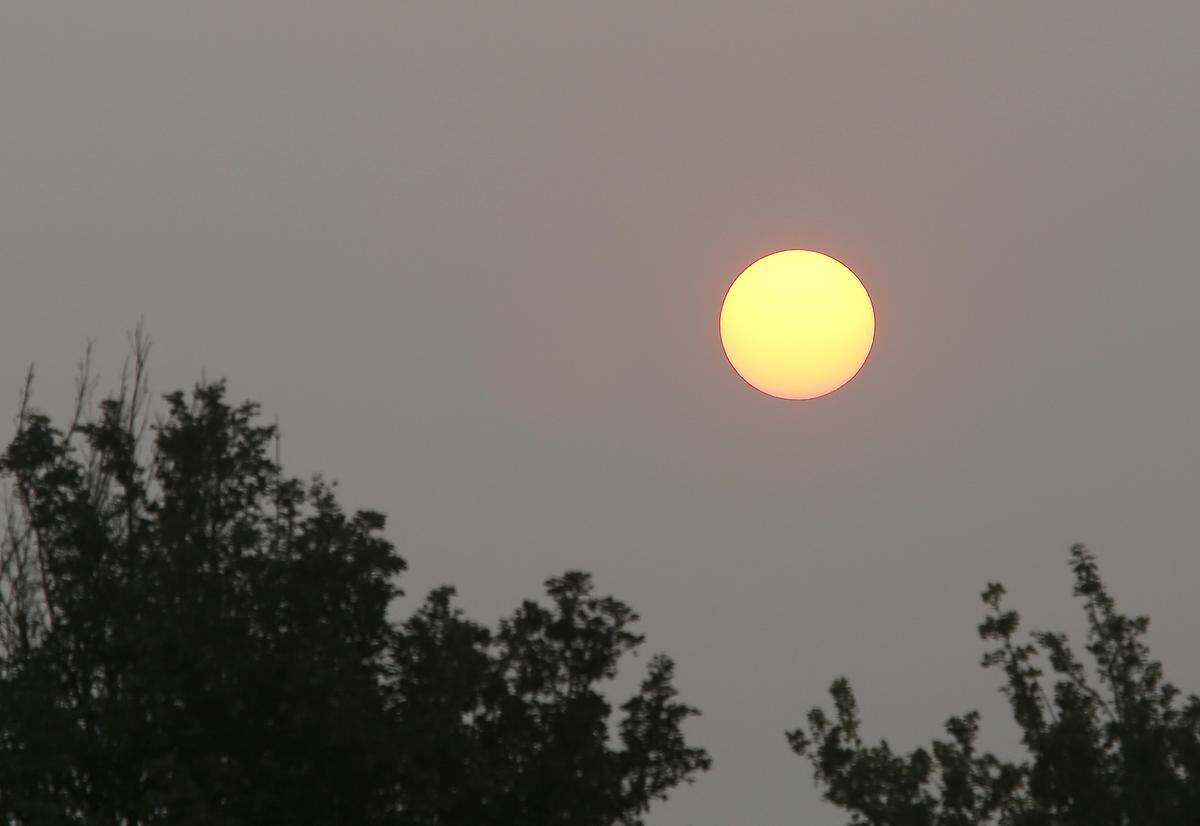 The sunrise takes on a warm glow as the rays of light are filtered through the dense smoke and haze that recently settled across the Mid-Columbia.