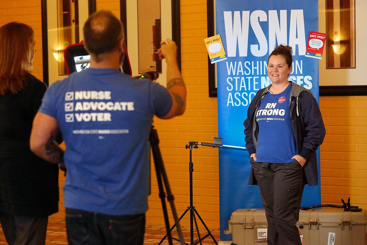 Kadlec nurse Kayln Michels poses for a promotional photo by co-worker Adam Halvorsen Tuesday morning after casting her ballot in the Washington State Nurses Association strike authorization vote held at the Red Lion Hotel in Richland.