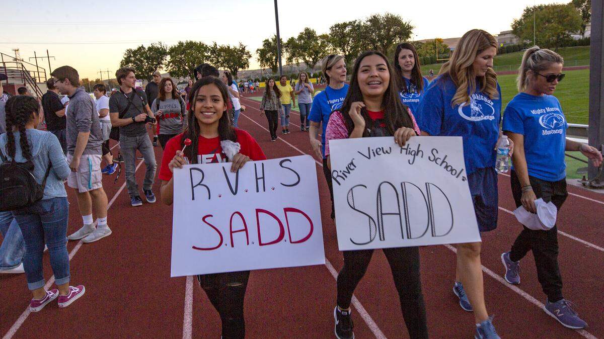 Students, faculty and families walk around the track at Fran Rish Stadium in Richland for the third annual “Strides to End Teen Suicide Walk” held by Hanford and Richland high schools. September is National Suicide Prevention Month.