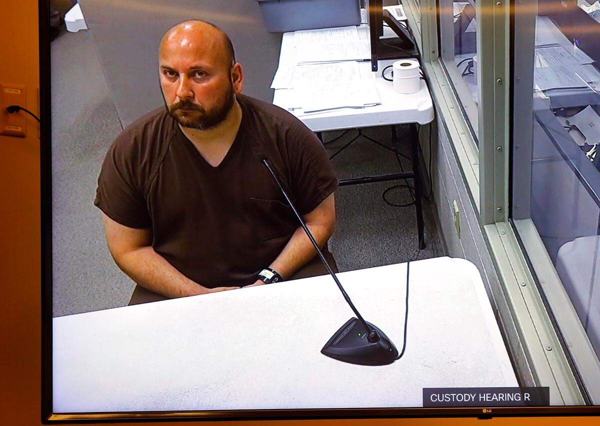 Jeffrey Whiston, 43, a Chiawana High School photography teacher, makes a preliminary appearance in Benton County District Court via a video link after he was arrested on investigation of sexual exploitation of a minor.