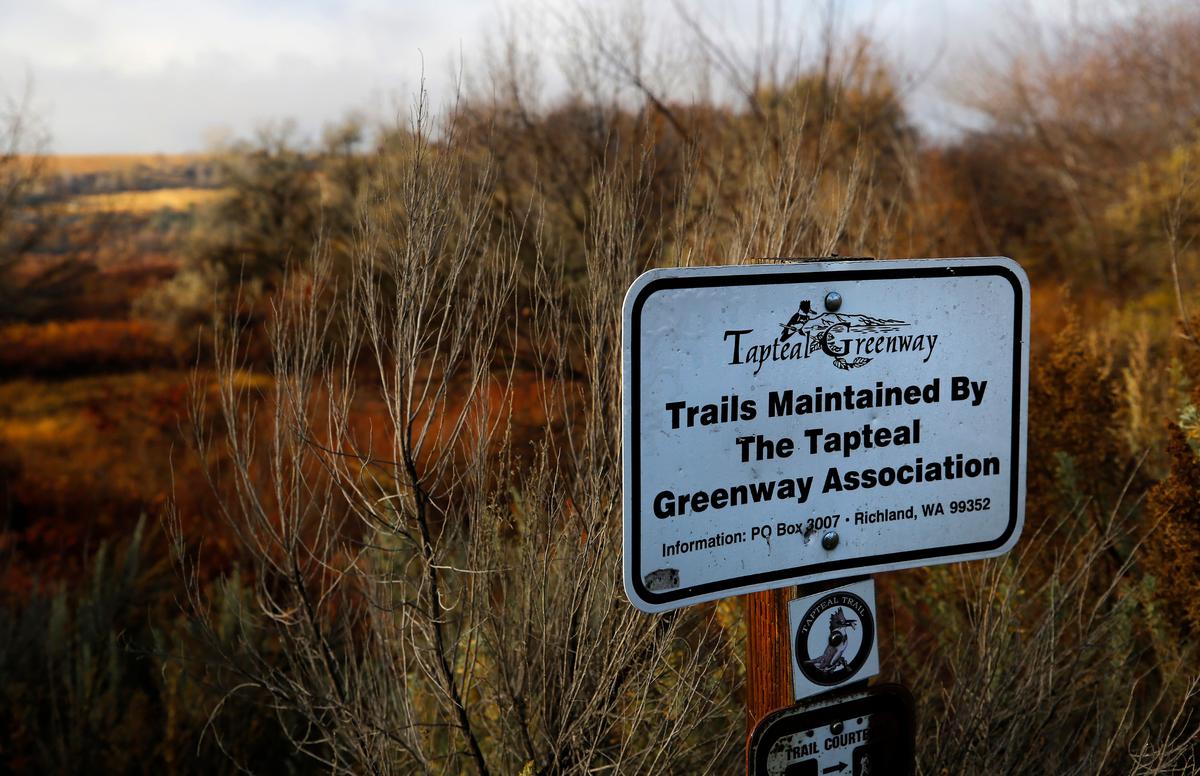A sign marks the Tapteal Greenway near the trailhead for W.E. Johnson Park in Richland.