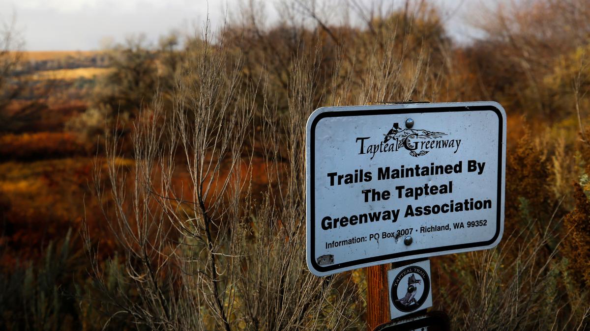 A sign marks the Tapteal Greenway near the trailhead for W.E. Johnson Park in Richland.
