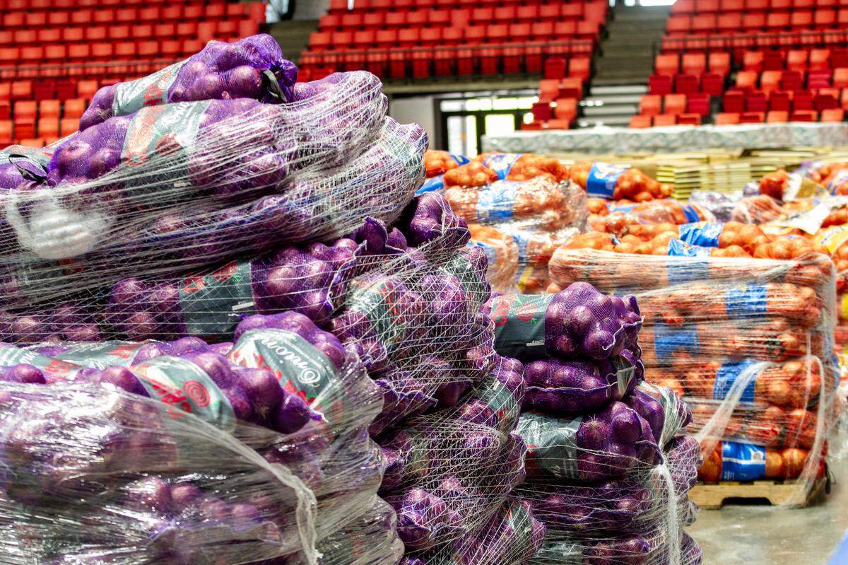 Pallets of potatoes and onions line the floor of the Toyota Center in preparation for a giveaway held by the Second Harvest of Tri-Cities, the Three Rivers Convention Center and the Washington Potato Commission in Kennewick last May.