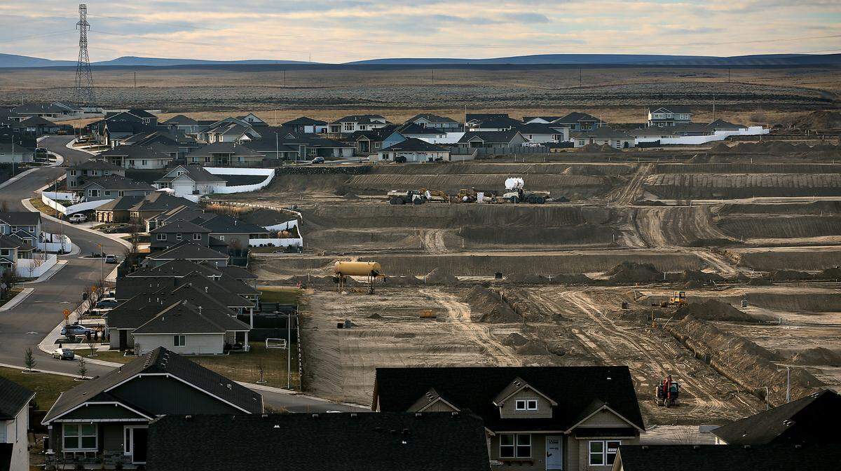 Heavy equipment is scattered for phases 7-9 of the Apple Valley housing development off the Bob Olson Parkway in south Kennewick. The new neighborhood has 125 lots.