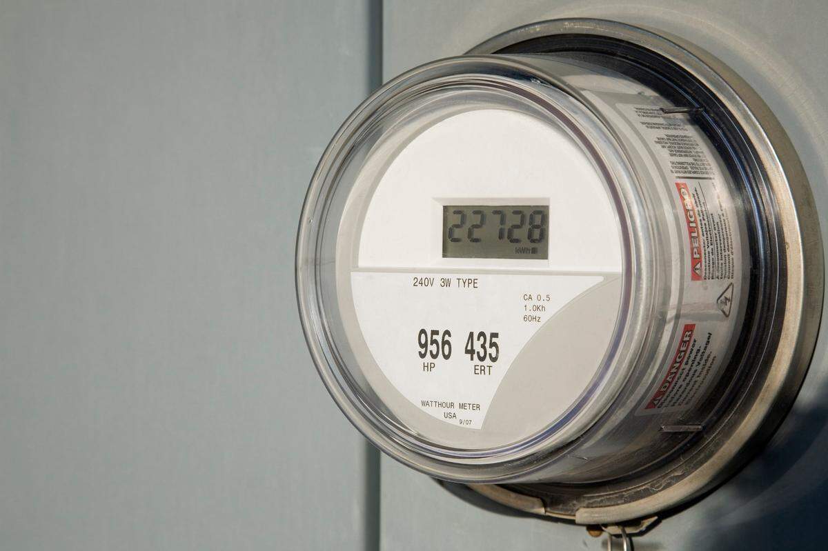 Residential digital electricity meter and base.
