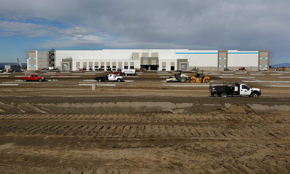 Work continues on the exterior of the Pearl Project building, which is one of the two new Amazon warehouses in east Pasco.