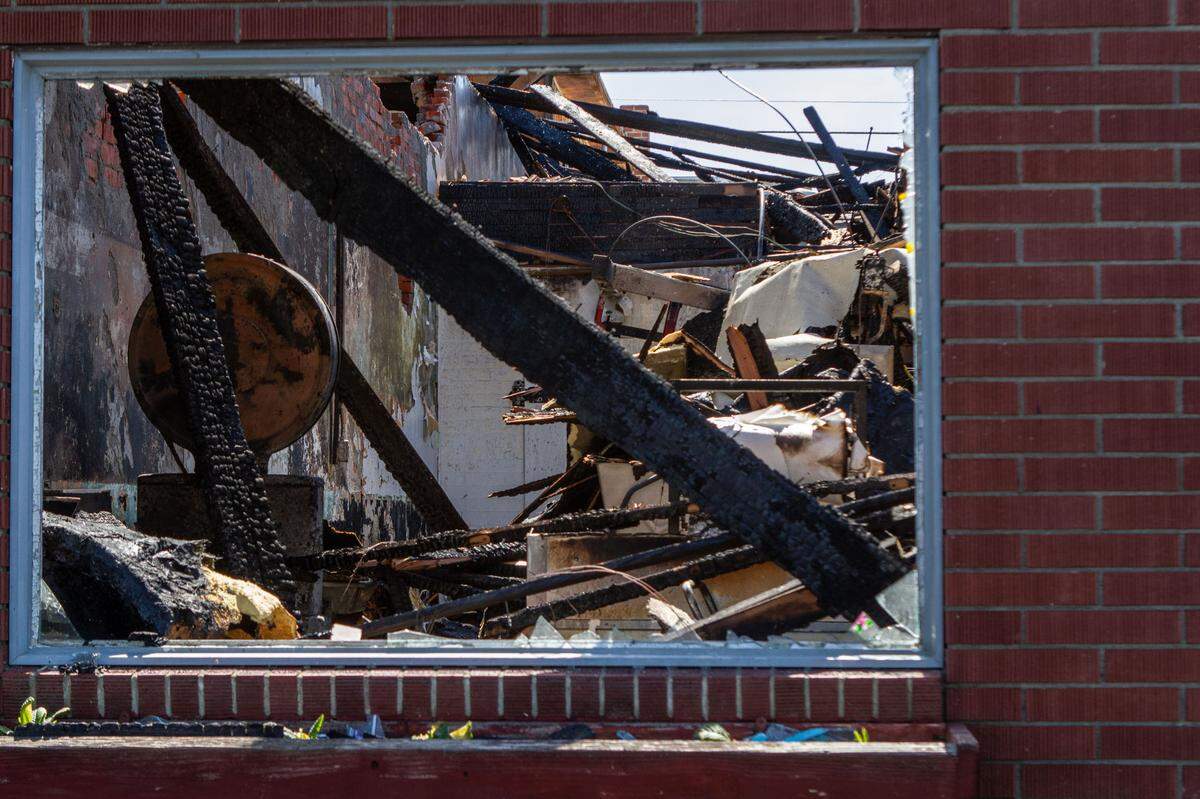 A window into Underwood’s Prosser Lockers, a butcher shop in downtown Prosser shows how the building was gutted in a fire.