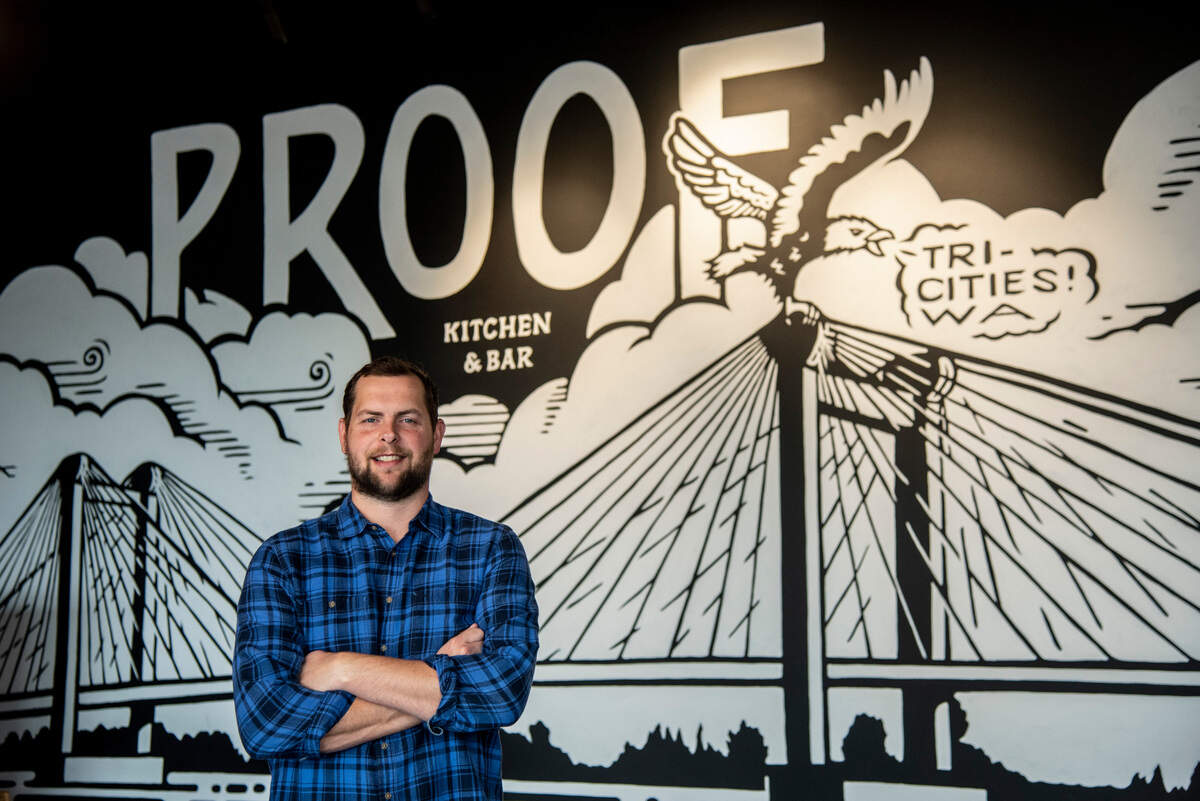 Michael Miller, the owner of Proof Gastropub in Kennewick, stands in the restaurant’s newest location, Proof Kitchen and Bar, in Pasco.
