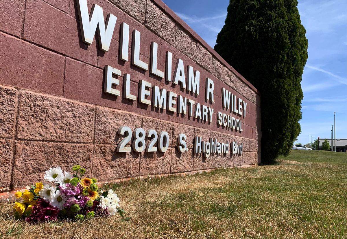 Flowers were placed at William Wiley Elementary School in West Richland after paraeducator Amber M. Rodriguez was shot outside the school.