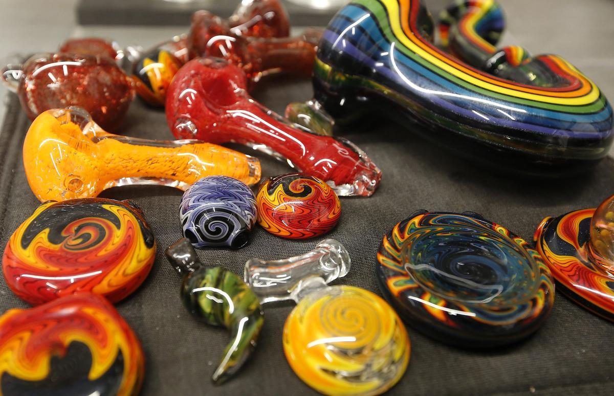 Brightly colored glass pipes are on display in the glass blowing work area at Prohibition Studios on North Everett Street in Kennewick. Watch a video at: tricityherald.com/video