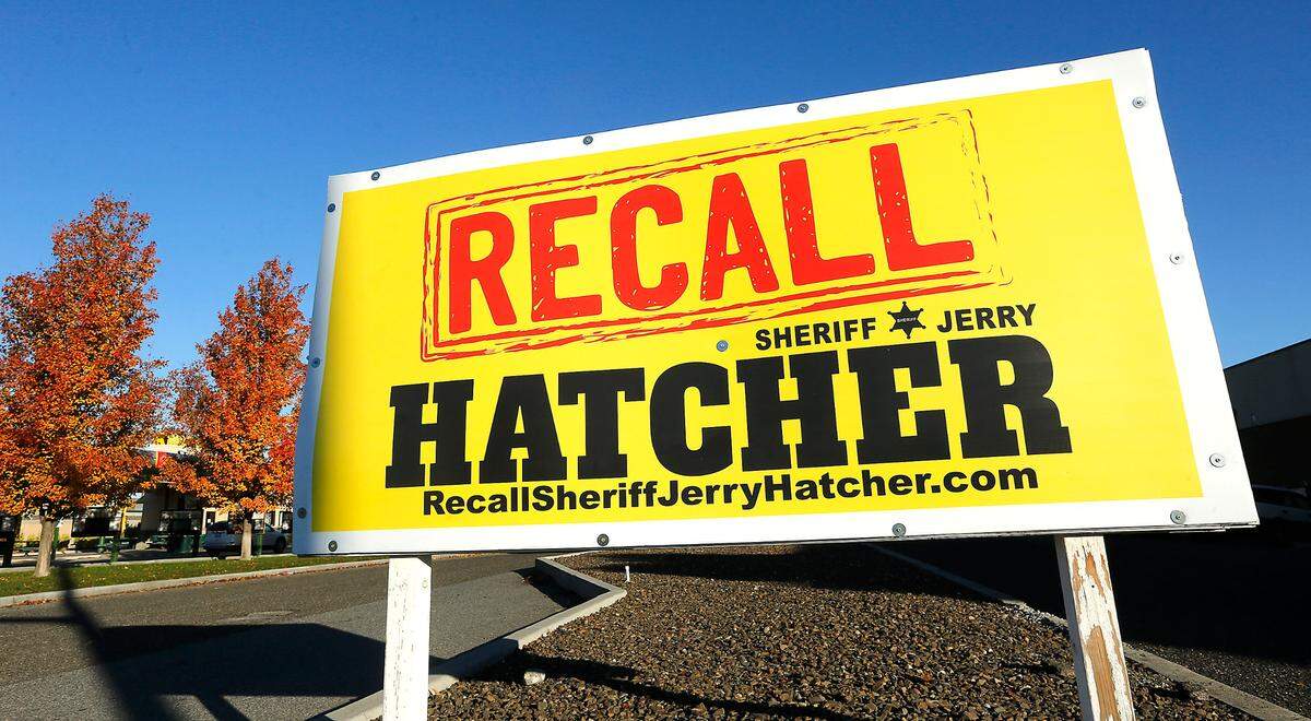 A sign calling for the recall of Benton County Sheriff Jerry Hatcher is posted on Gage Boulevard at the intersection with West Grandridge Boulevard in Kennewick.