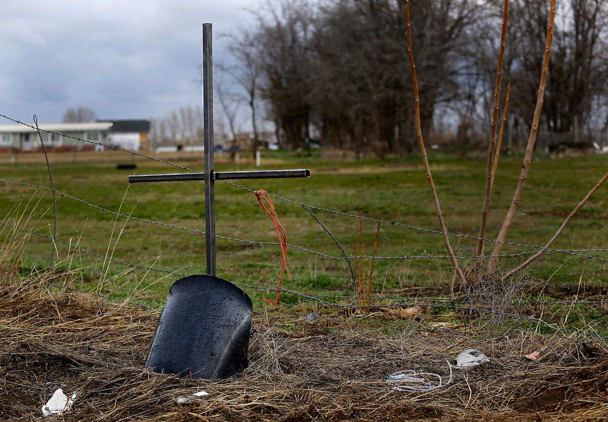 A welded steel cross and a piece of the motorcycle faring have been placed as a roadside memorial for Khyl W. Cassano of Kennewick.