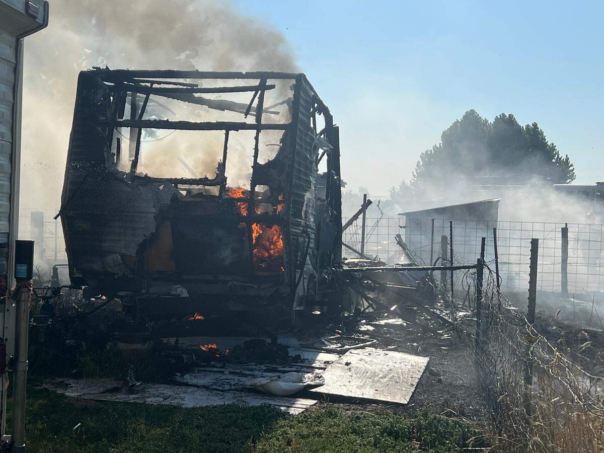 A fire started in a travel trailer on Pidcock Road on Sunday afternoon, and spread to grass and a nearby shed.