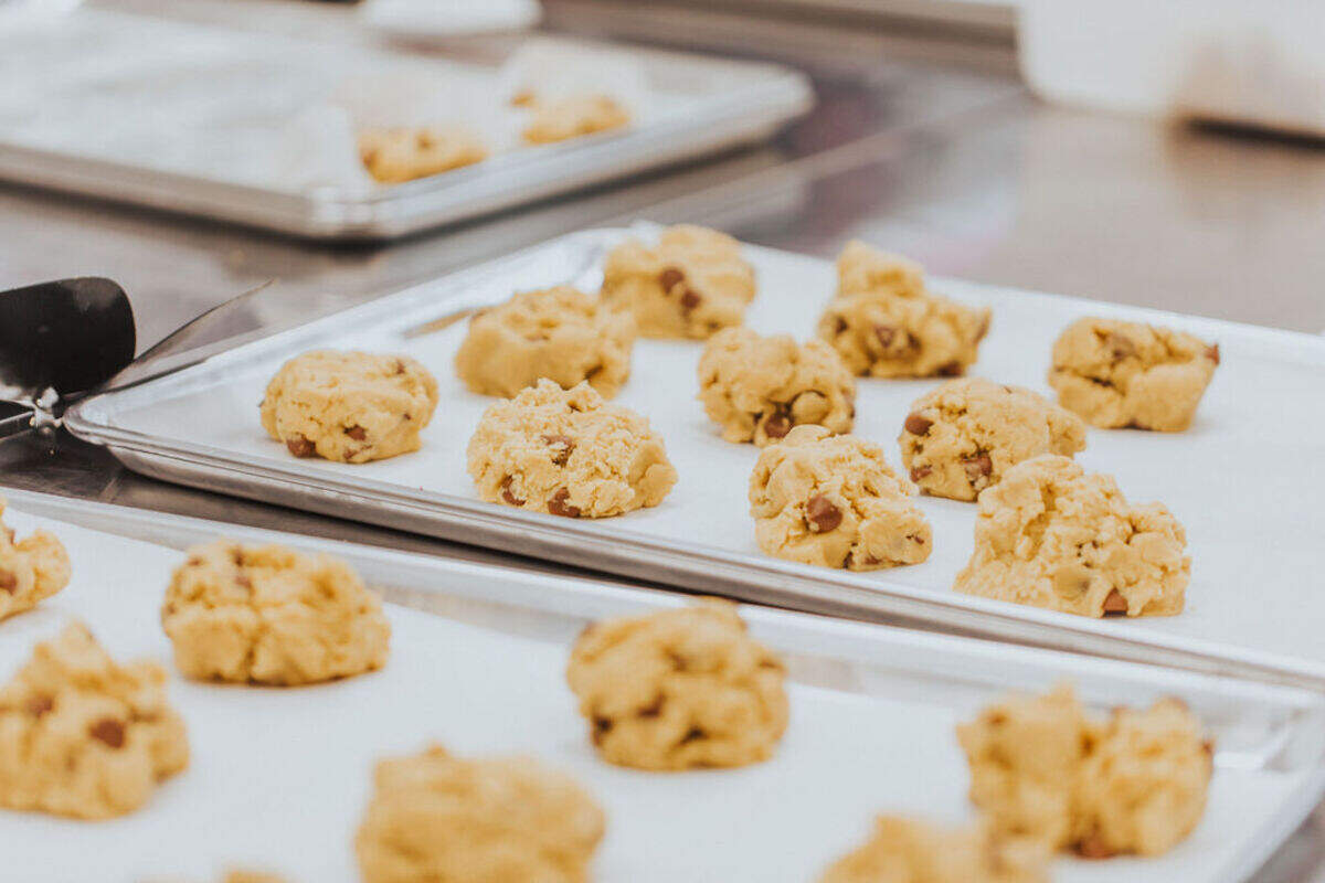 Freshly made warm milk chocolate cookies are a mainstay of the quickly expanding Crumbl Cookie chain that also is opening in Richland in March.