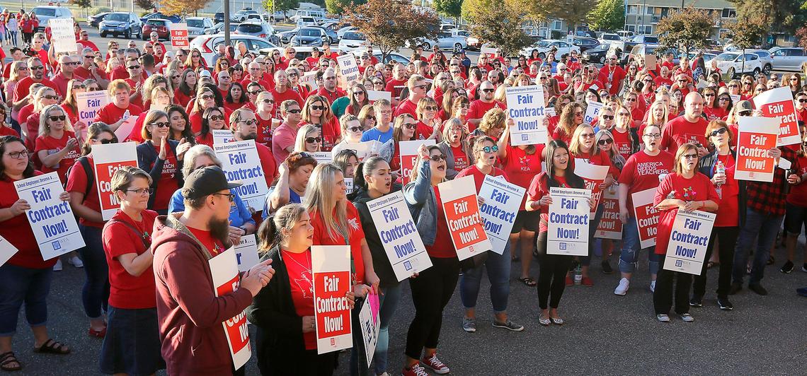 Kennewick educators and their supporters fill the parking lot of the Kennewick School District administration offices early Monday morning to hold a staff excellence rally to show solidarity for their bargaining team.