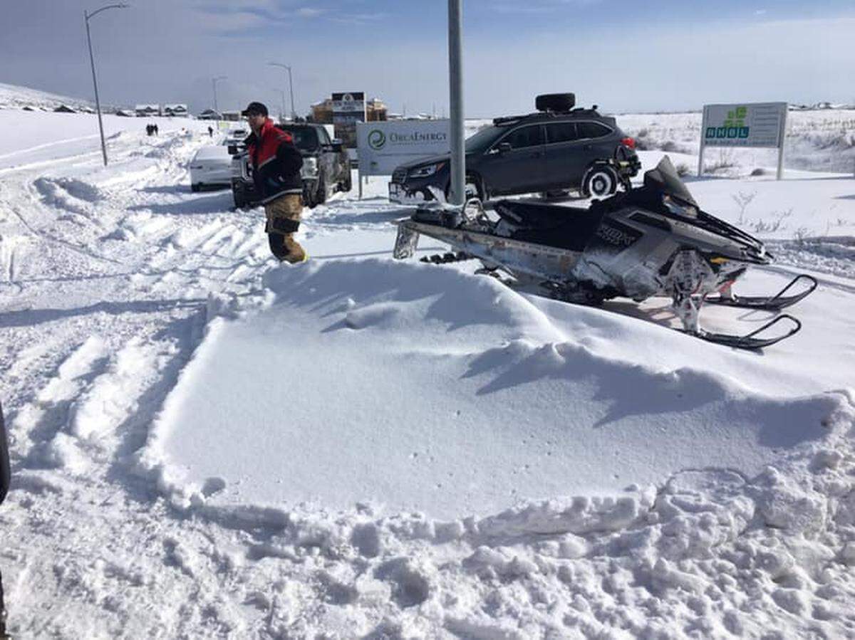 Richland emergency workers used a borrowed snowmobile to transport a patient on unplowed roads to a waiting ambulance.