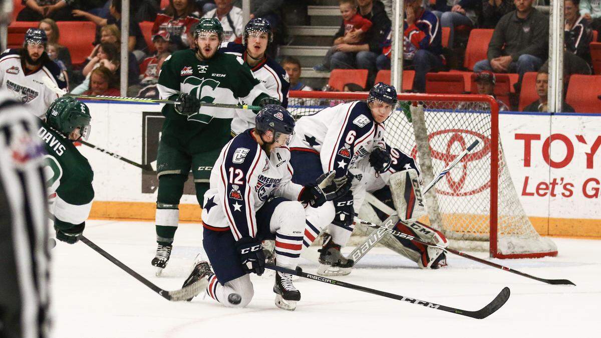 Tri-City's Jordan Topping (12) blocks a shot by Everett's Kevin Davis during Game 3 of the Western Conference finals Monday at Toyota Center. The Silvertips beat the Americans 8-4.