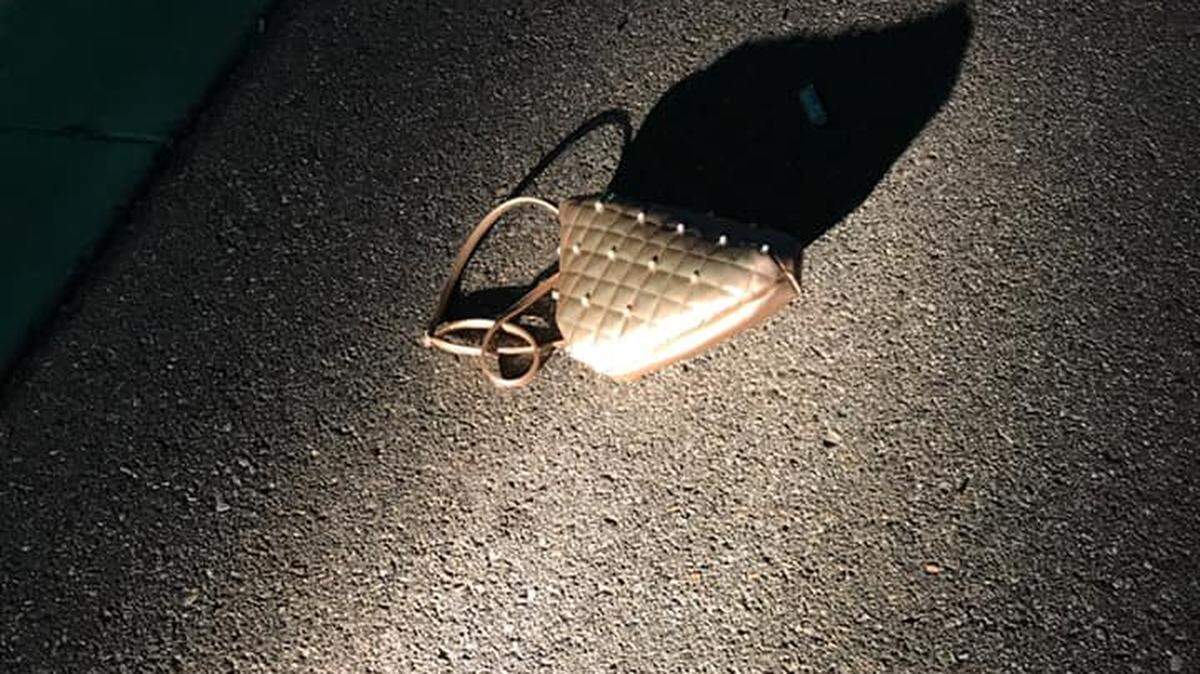 A man grabbed a purse through an open passenger window Monday setting off a chase that ended with a crash on Gage Boulevard.