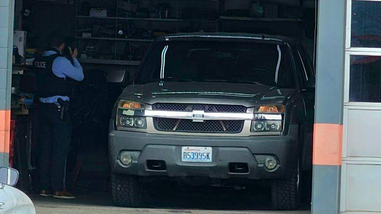 Person hit by a pickup inside Richland auto repair shop