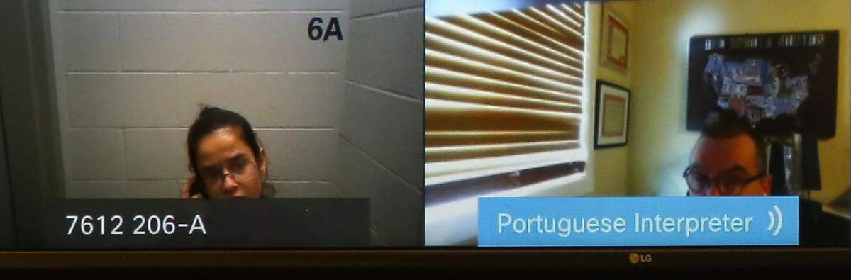 Mariana Souza, 28, the driver Kennewick police accuse of killing two people in a collision April 3,  while drunk, makes an appearance via a video link Thursday morning with a court certified Portugese interpreter in Benton County Superior Court. 