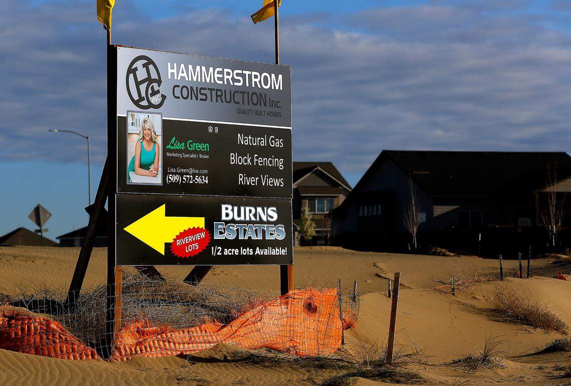 A sign advertises for a new housing development off Burns Road at the intersection with Broadmoor Boulevard in west Pasco. In the future, the west Pasco area will be developed with about 7,000 homes and up to 750,000 square-feet of retail space.