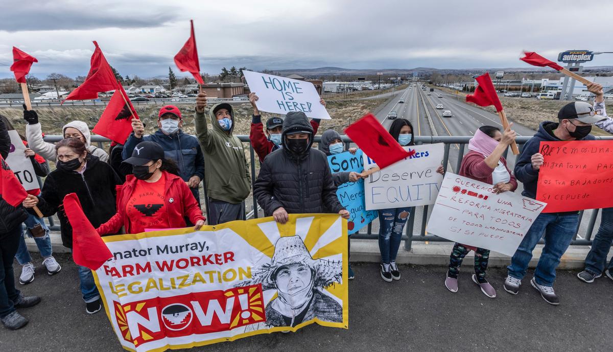 The “Day Without Immigrants” rally started in a parking lot on Road 28 and wound up to West Court Street where demonstrators lined the walking bridge over Highway 395, chanting and waving flags in an effort to draw attention to the importance of their cause.
