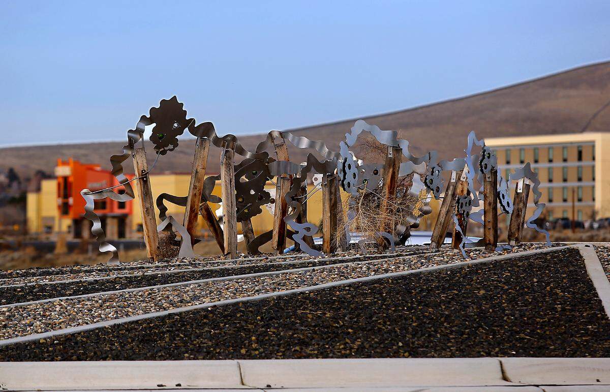 “Waves of Viticulture,” is a low-slung metal piece inspired by the region’s vineyards, in the roundabout at Queensgate/I-182 interchange.