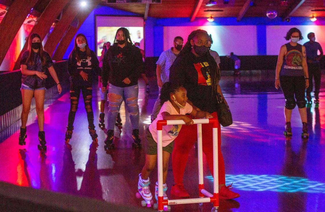 Ayanna Anderson, 5, skates with some help from her mother Naquanna Muse during the 2021 Juneteenth skate night at Rollarena in Richland. 